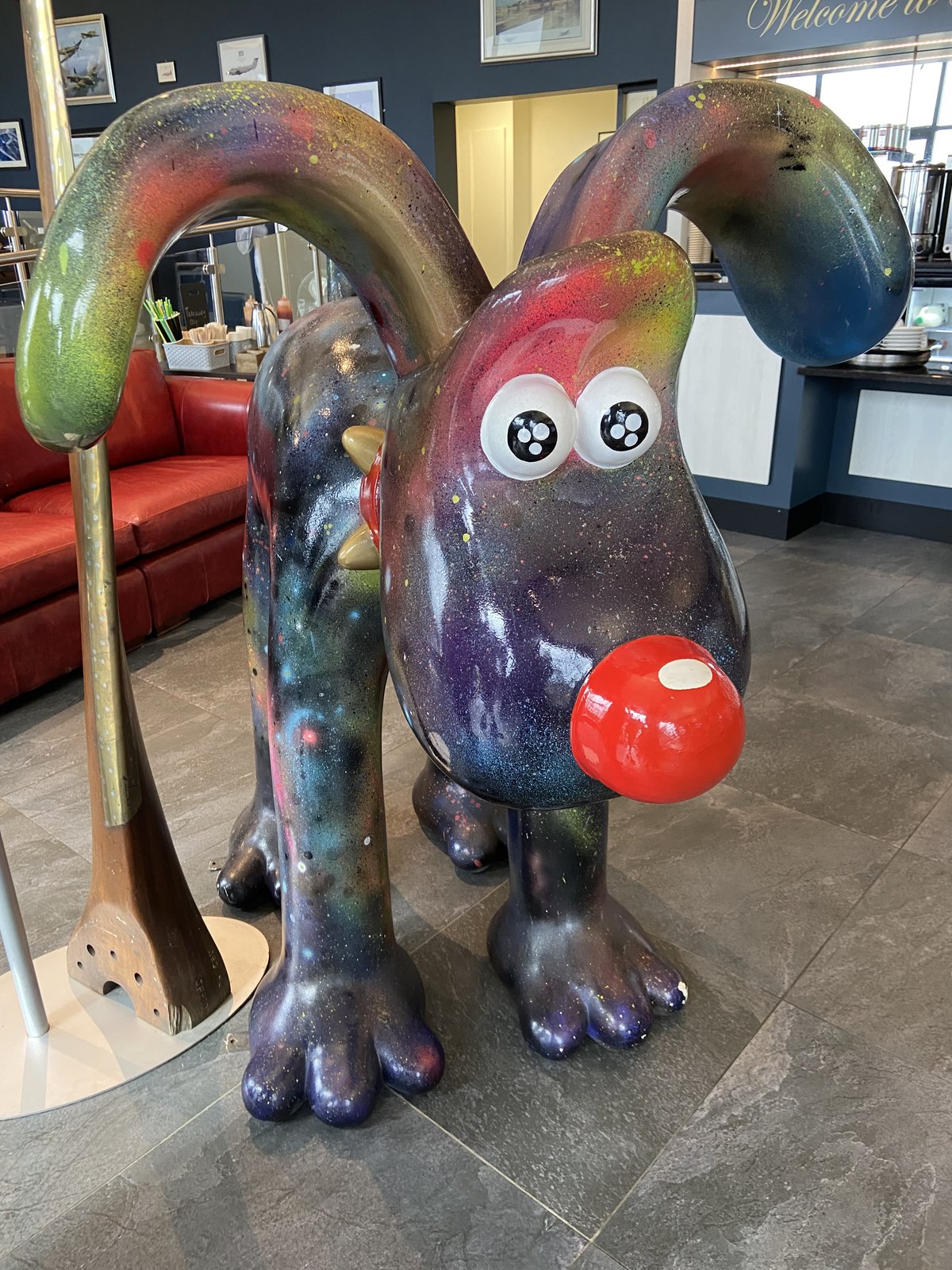 Galaxy-painted Gromit sculpture inside the AV8 cafe