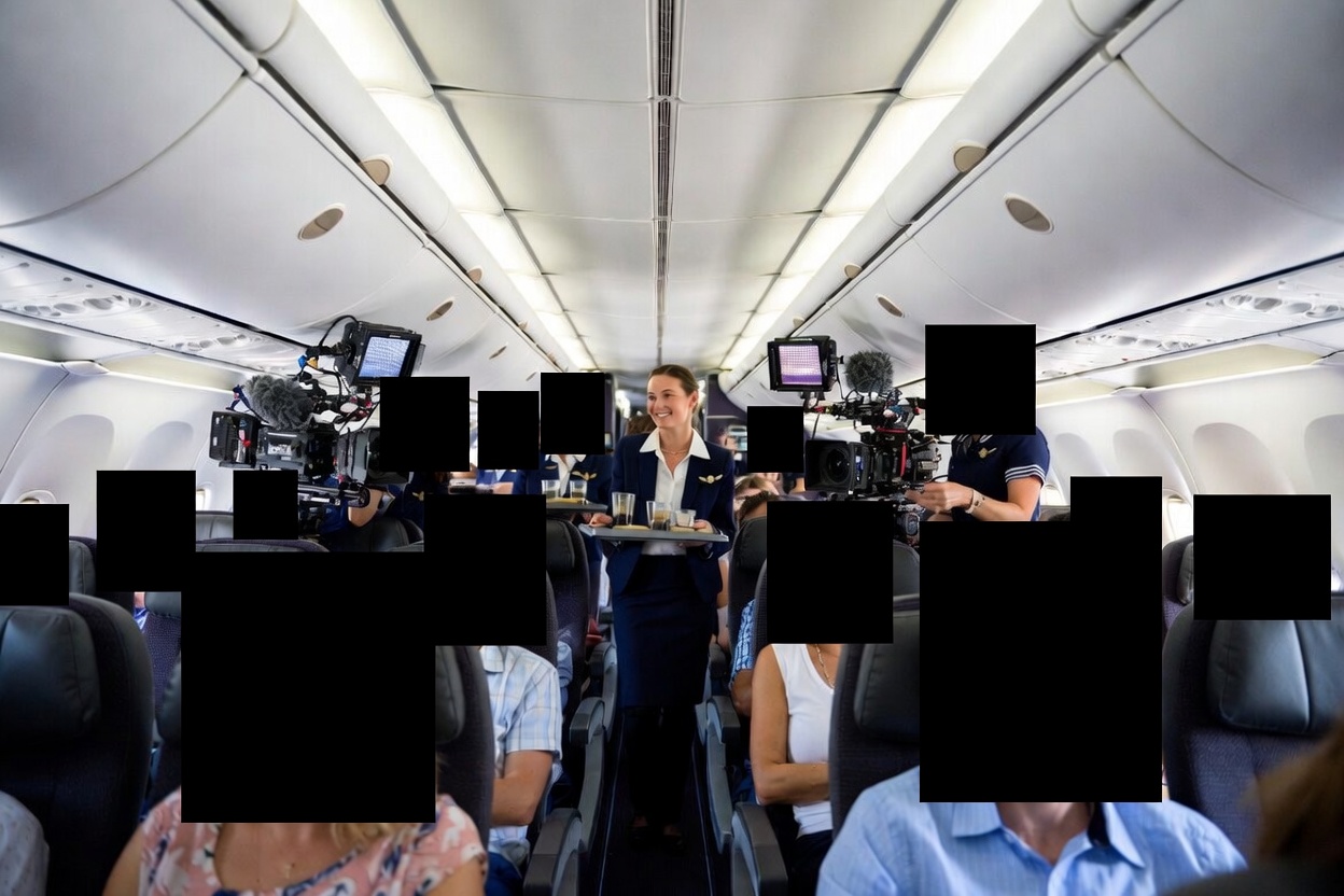 Airline passengers with blacked out faces.